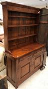 A modern cherry wood dresser in the 19th Century manner,