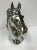 A polished aluminium horse head ornament 45cm high