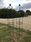 A pair of modern plant obelisks,