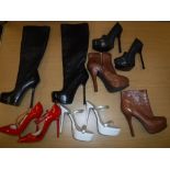 A pair of Christian Louboutin red patent stilettoes, size 34, a pair of Yves St.