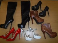 A pair of Christian Louboutin red patent stilettoes, size 34, a pair of Yves St.