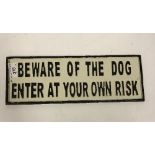 A modern painted cast iron sign inscribed "Beware of the Dog...", approx 35.