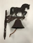 A painted cast metal "Heavy Horse" bell 29 x 41 cm