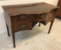 A 19th Century mahogany and rosewood cross-banded satinwood strung serpentine fronted side table