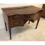 A 19th Century mahogany and rosewood cross-banded satinwood strung serpentine fronted side table