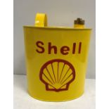 A modern painted metal fuel can inscribed "Shell" 34 cm