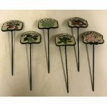 A set of six painted cast iron salad signs inscribed "Sweet Pea", "Tomato", "Runner Beans",