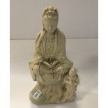 A Chinese blanc de chine figure of Guan Yin with attendant,