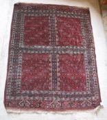A Hatchilli Bokhara rug with four repeating panels,