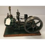 A vintage Stuart Turner No. 9 stationary steam engine, green painted on oak base, approx 18.