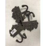 Three modern painted cast iron robe hooks inscribed "GWR"