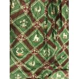 A pair of lined curtains with lattice style design with stags, lions, etc, on a green ground,