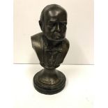 A modern bronzed bust of Winston Churchill,