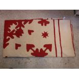 A vintage American quilt of red and cream design CONDITION REPORTS Is backed with