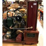 A Stuart & Turner stationary steam engine with a Godwin A186 pump in brass and red painted cylinder