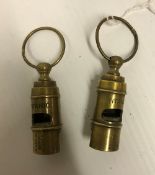 Two modern reproduction brass whistles inscribed "Titanic", 6.