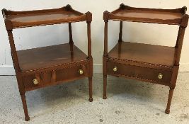 A pair of modern yew wood two tier side tables with single drawer,