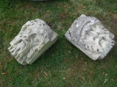 Two carved stone head corbels (possibly from the 15th Century church ruins at bottom of Mill Lane