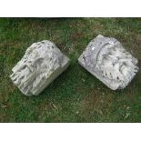 Two carved stone head corbels (possibly from the 15th Century church ruins at bottom of Mill Lane