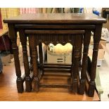 A modern oak nest of three occasional tables, a mahogany pot cupboard, fabric covered fire screen,