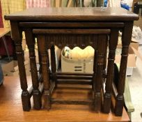 A modern oak nest of three occasional tables, a mahogany pot cupboard, fabric covered fire screen,