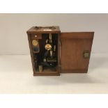 A circa 1900 mahogany cased lacquered brass and anodised monocular microscope, case 27.