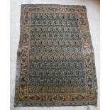 A Kashan rug with all over leaf decoration on a blue ground,