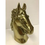 A gold coloured cast aluminium horse head ornament 45cm high