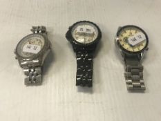 Two Breitling-style wristwatches and a Tag-style wristwatch