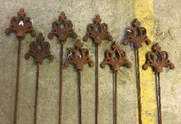 A set of eight metal garden stakes