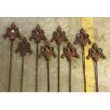 A set of eight metal garden stakes