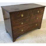 A 19th Century mahogany square fronted chest of two short over two long drawers with brass ring