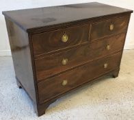 A 19th Century mahogany square fronted chest of two short over two long drawers with brass ring