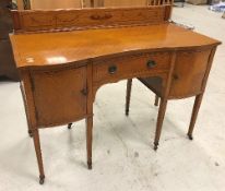 An Edwardian Sheraton Revival satinwood and inlaid sideboard with raised back over central drawer