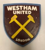 A modern painted cast iron sign inscribed "West Ham United", approx 21.