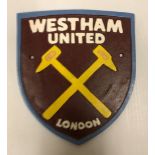 A modern painted cast iron sign inscribed "West Ham United", approx 21.