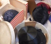 A box of assorted vintage leather handbags and hats