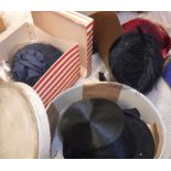 A box of assorted vintage leather handbags and hats