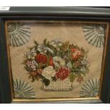 A needlework panel depicting a basket of flowers,