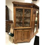 A 19th Century oak and mahogany inlaid free-standing corner cabinet,