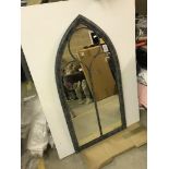 A Gothic style outdoor mirror,