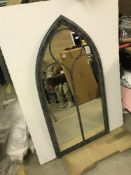 A Gothic style outdoor mirror,