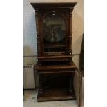 A walnut cased "Symphonion", penny operated, with frieze drawer,