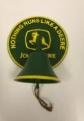 A reproduction painted metal John Deere wall mounted bell