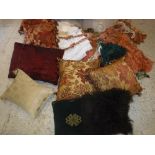 A collection of scatter cushions together with a large assortment of tassel tie-backs