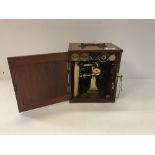 A late Victorian mahogany cased lacquered brass monocular microscope by Dolland of London with