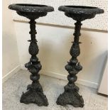 A pair of 20th Century patinated bronze pedestal planters in the Italianate taste with cherubic and