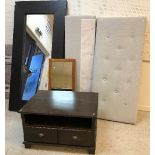 A dark stained oak framed rectangular wall mirror, a modern upholstered headboard and footboard,