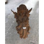 A modern cast iron figure of an Angel praying,