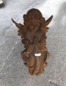 A modern cast iron figure of an Angel praying,